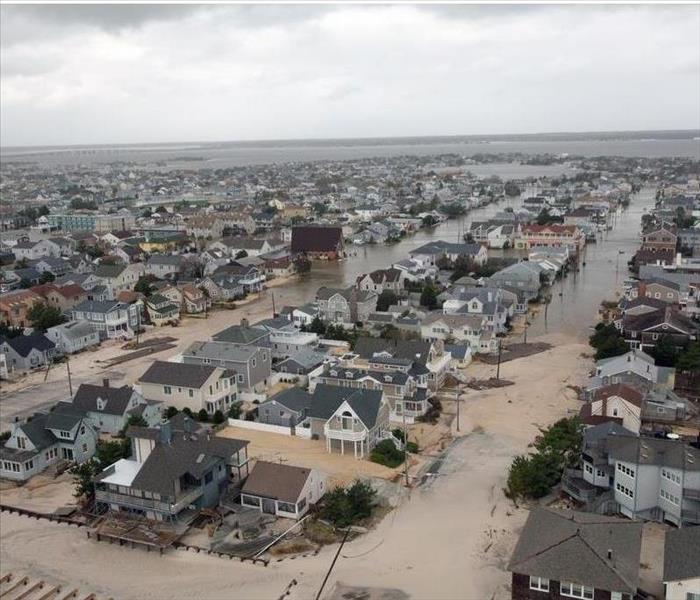 overhead view of shore town covered in sand and water