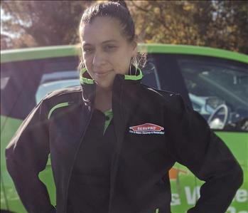 SERVPRO of Jersey City shares picture of one of their female project managers standing in front of a work vehicle.